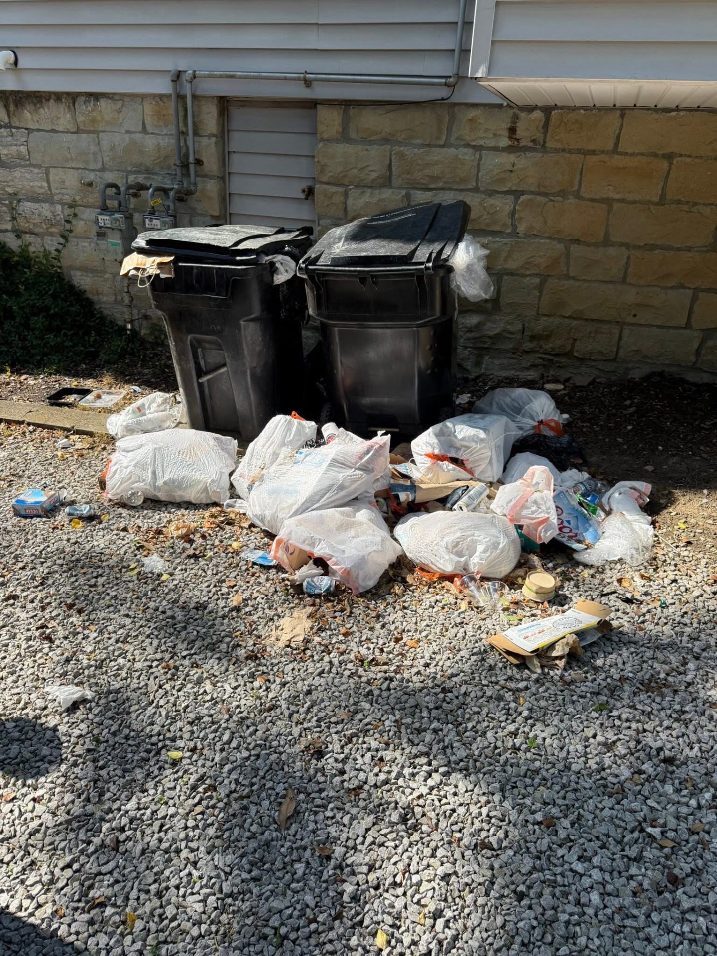 CURBSIDE PICKUP: Overflow bags hauled away β bins back to empty.